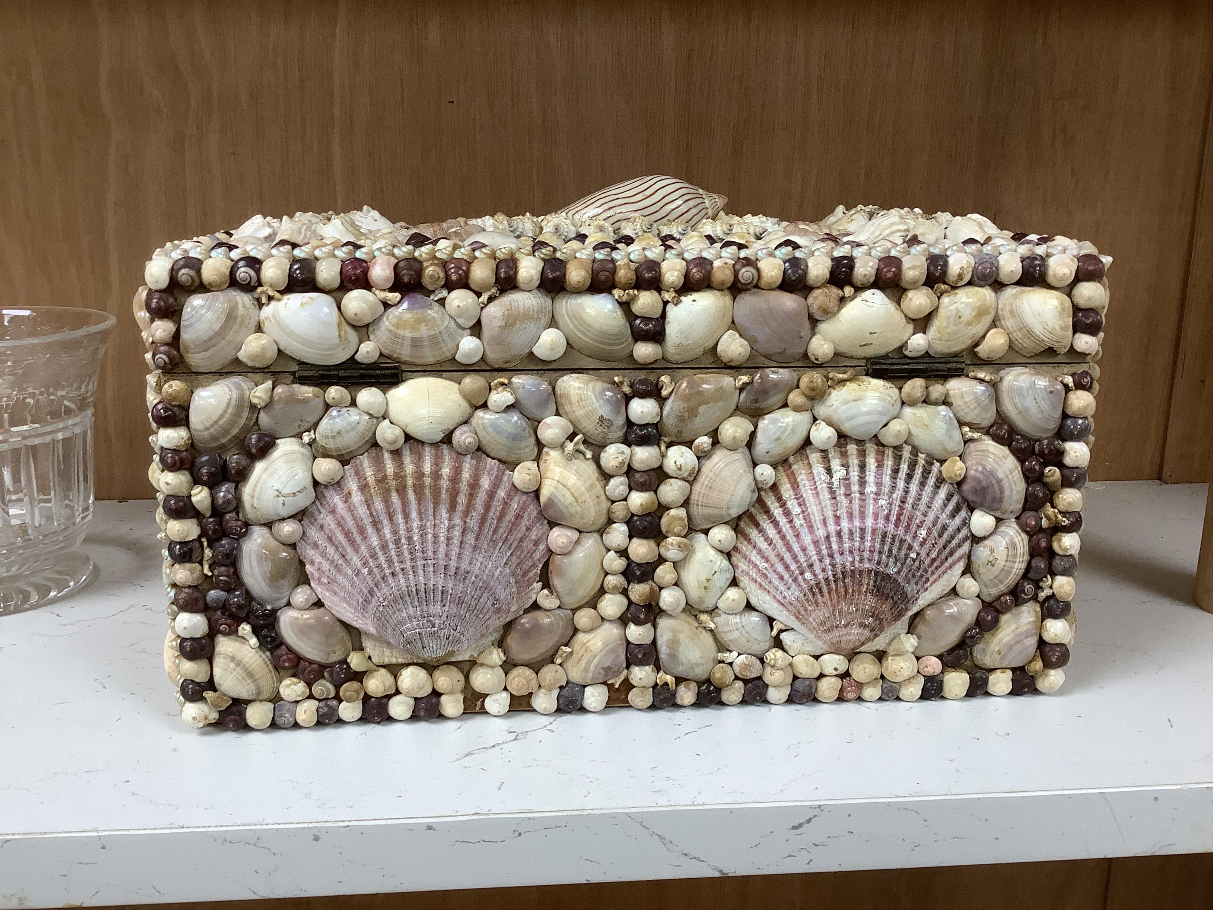 A George III tea caddy, shell covered in 19th century. 32cm wide x 15cm high x 17cm deep. Condition - a few shells missing but appears in good condition